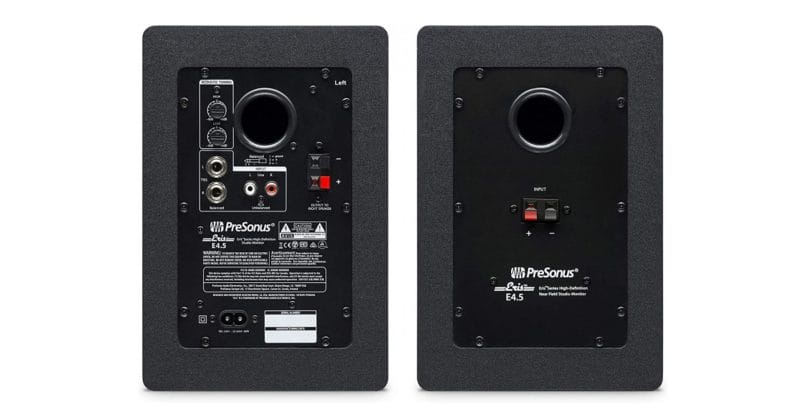 the back of a pair of powered speakers showing cable connections